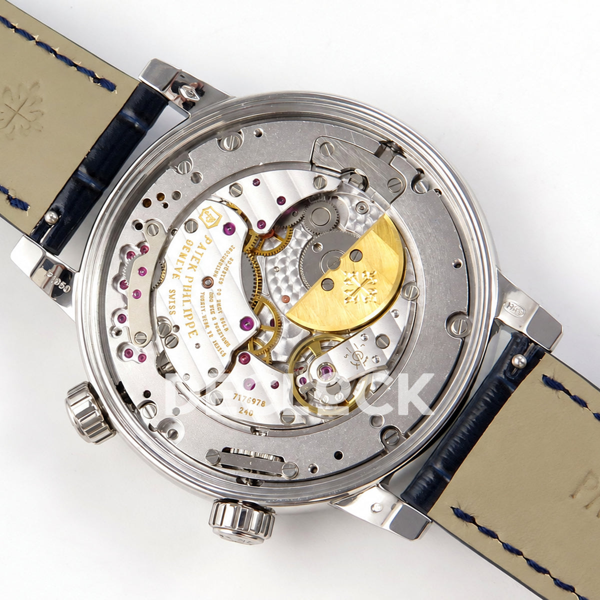 Patek Philippe Celestial 6104/12P-010 PPF replica with blue dial and red-purple stone bezel — exposed movement and right-facing micro rotor
