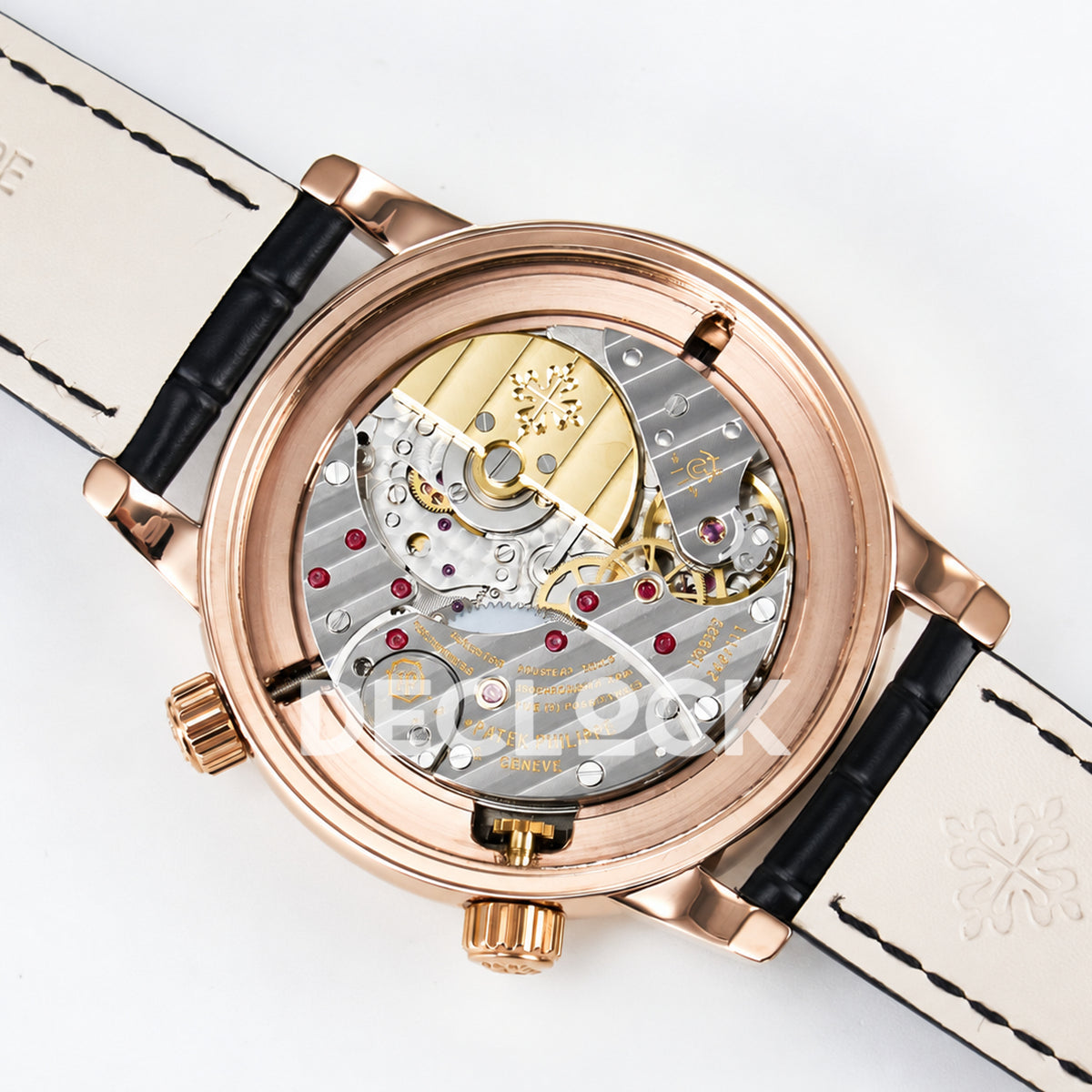 Patek Philippe Celestial Moon Age YLF replica with black dial and rose-gold-tone case — open movement angled view