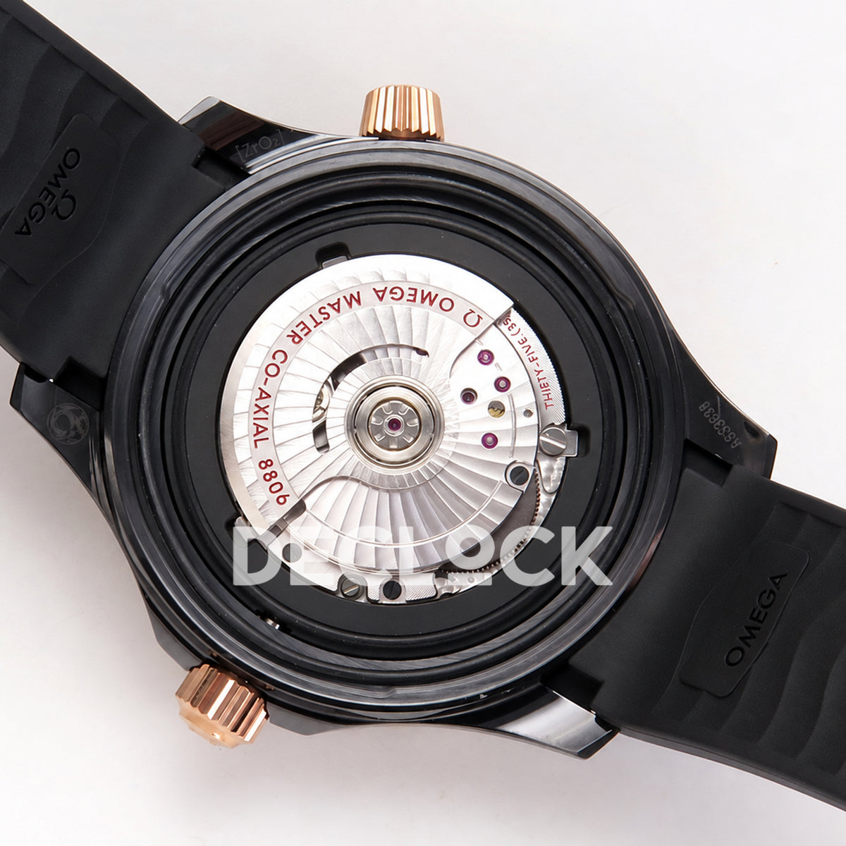 Omega Seamaster Diver 300M ORF black ceramic rose gold tone rubber 8806 Free Sprung — open caseback movement view
