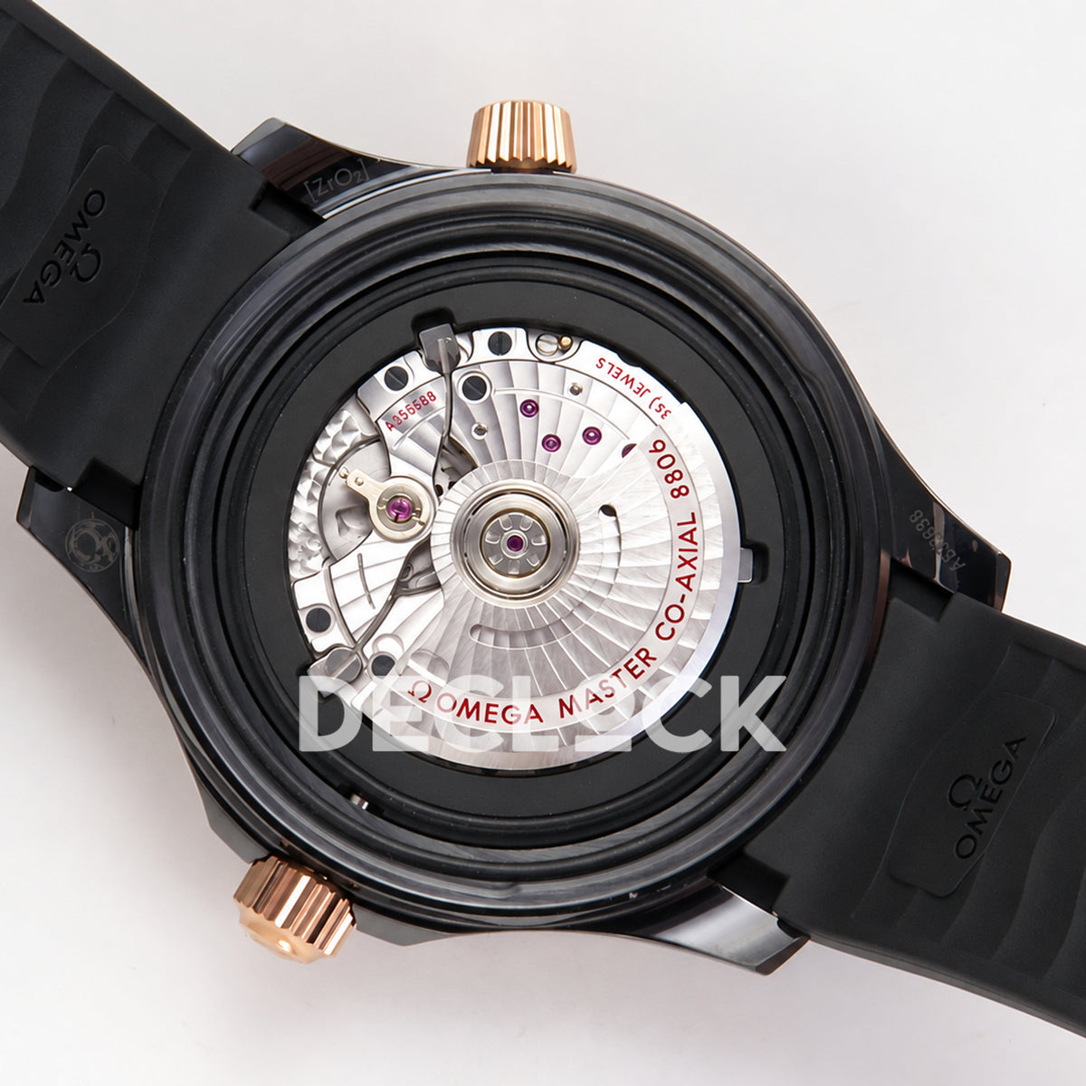 Omega Seamaster Diver 300M ORF black ceramic rose gold tone rubber 8806 Free Sprung — open caseback rotor view