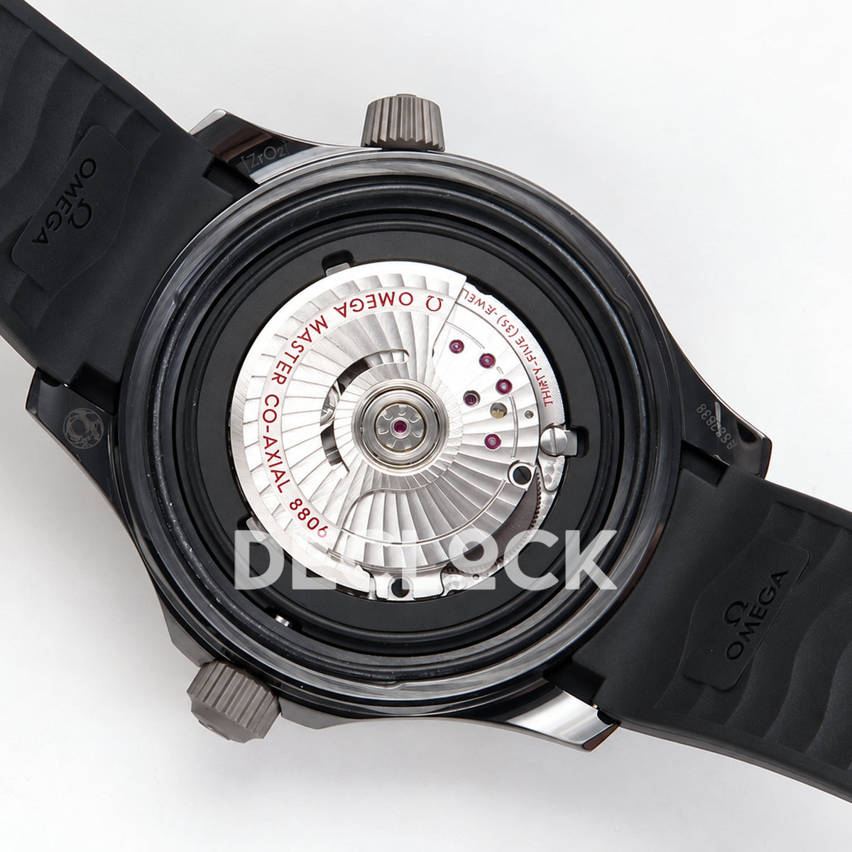 Omega Seamaster Diver 300M ORF black ceramic steel rubber 8806 Free Sprung — open caseback movement view