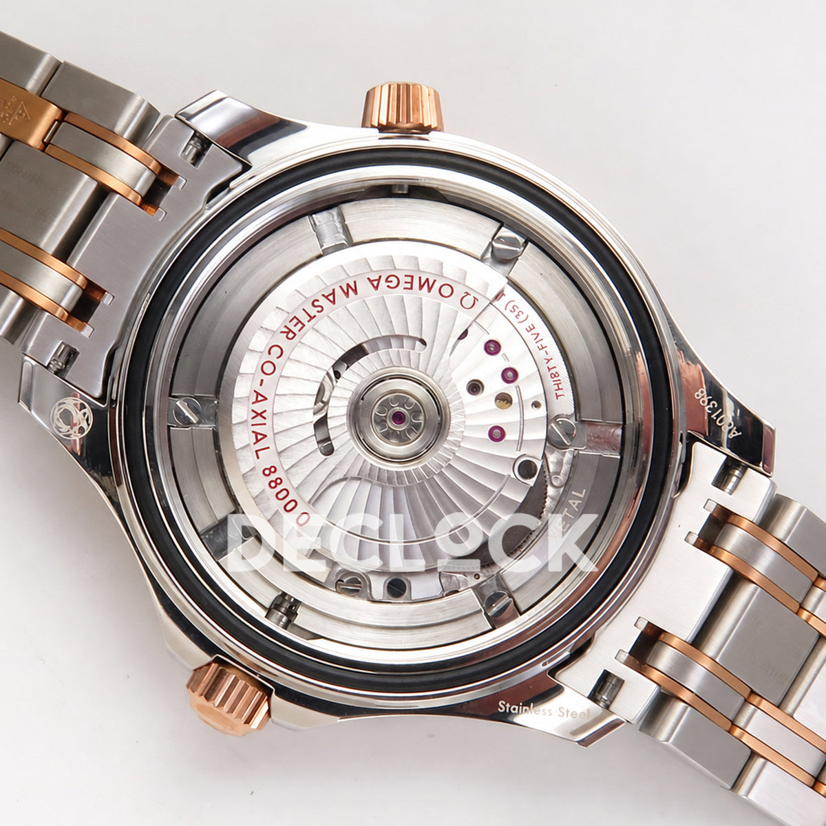 Omega Seamaster Diver 300M ORF Blue Steel Rose Gold 8800 Free Sprung — open caseback movement view