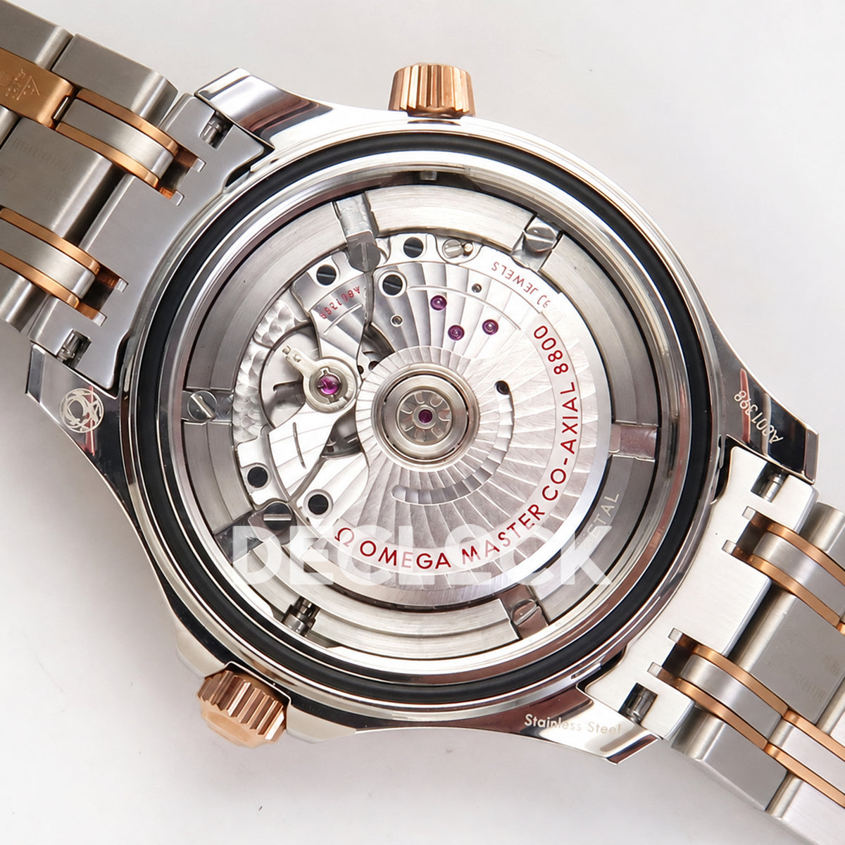 Omega Seamaster Diver 300M ORF Blue Steel Rose Gold 8800 Free Sprung — open caseback rotor view