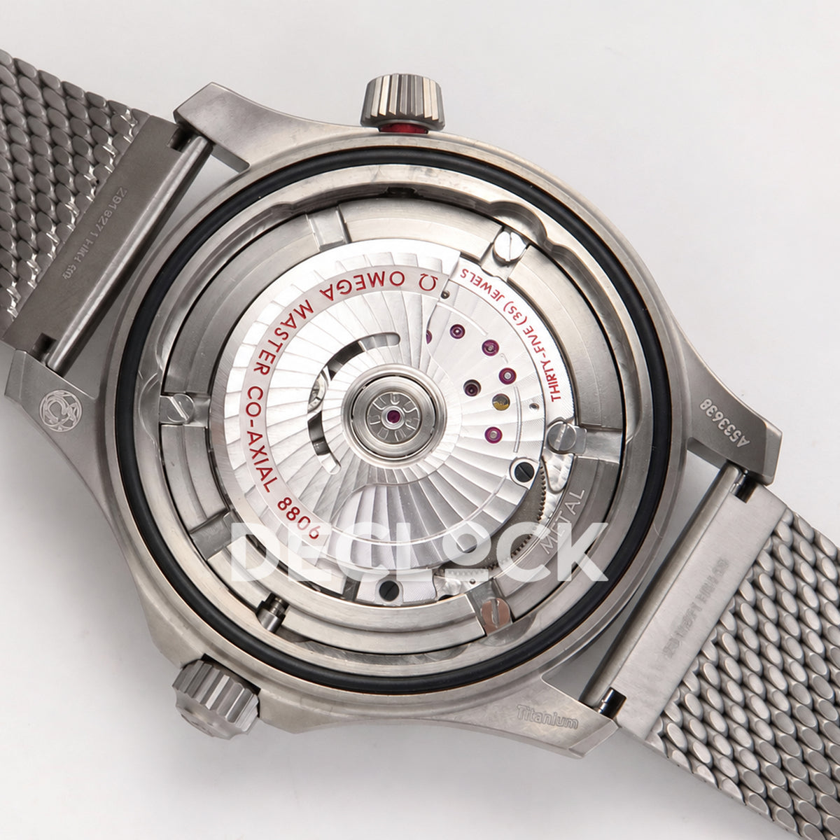 Omega Seamaster Diver 300M No Time To Die ORF titanium mesh 8806 Free Sprung — open caseback movement view