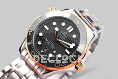 Replica Omega Seamaster Diver 300m Omega Co-Axial Master Chronometer 42mm Black Dial with Blue Bezel in Steel/Yellow Gold