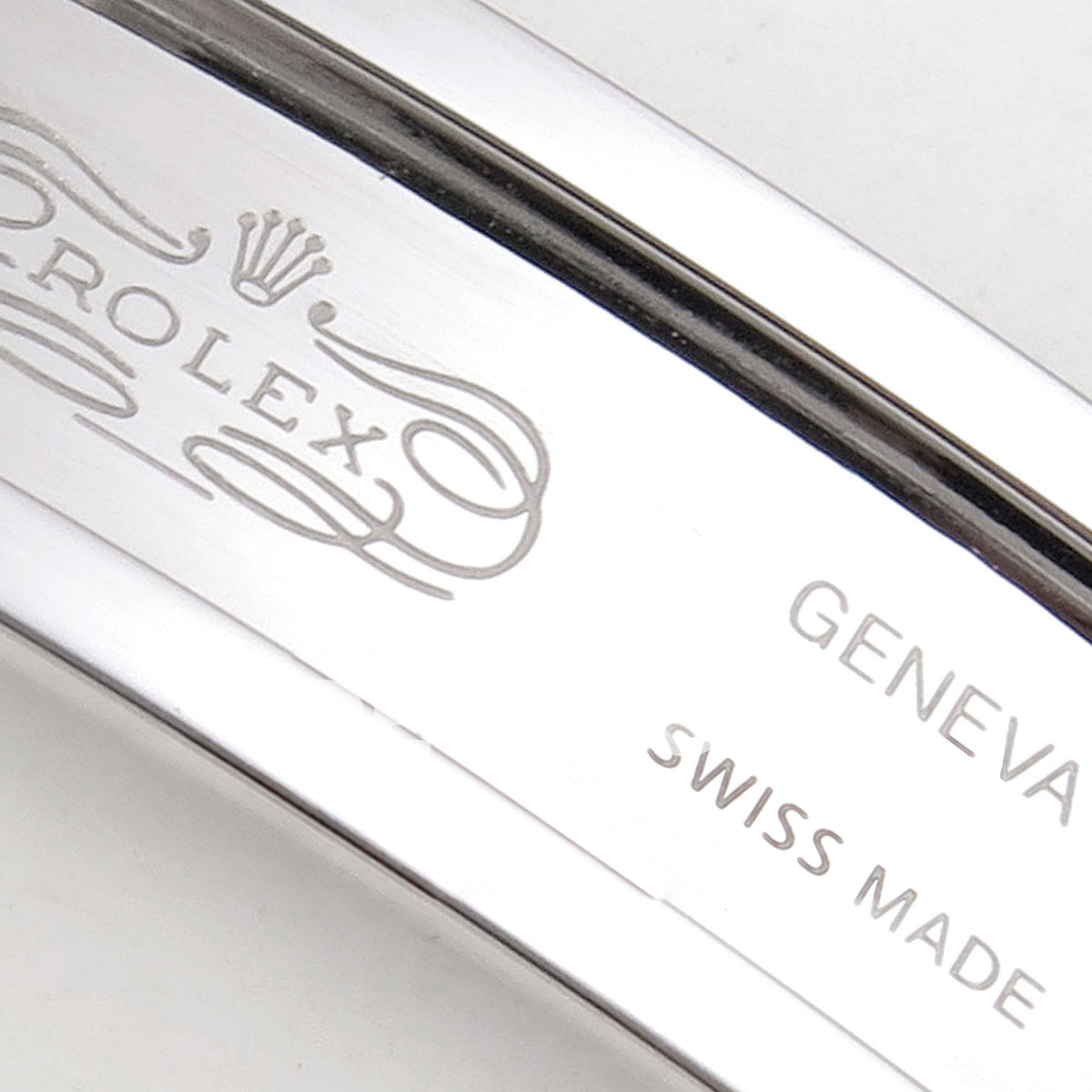 Rolex Datejust 31 278273 Dark Gray Baton Yellow Two-Tone Jubilee XRF A2236 replica - Macro of the actual ROLEX crown and scrollwork, GENEVA and SWISS MADE engraving inside the clasp
