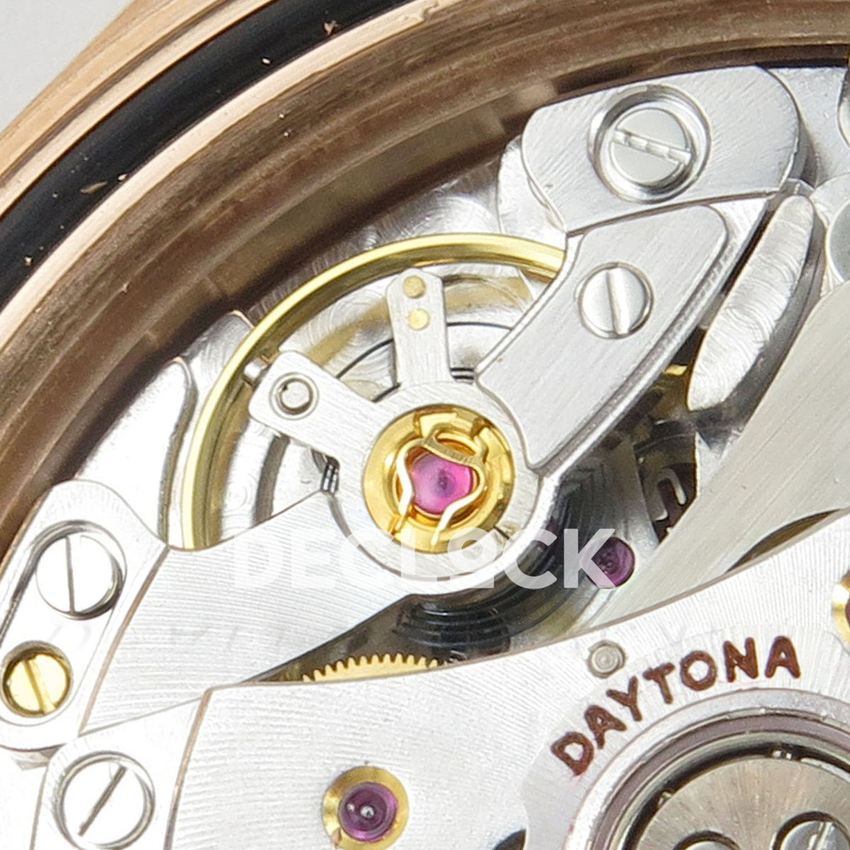 Rolex Daytona 116595RBOW AVF replica - original gold balance wheel, purple jewel, regulator and red Daytona engraving in close-up