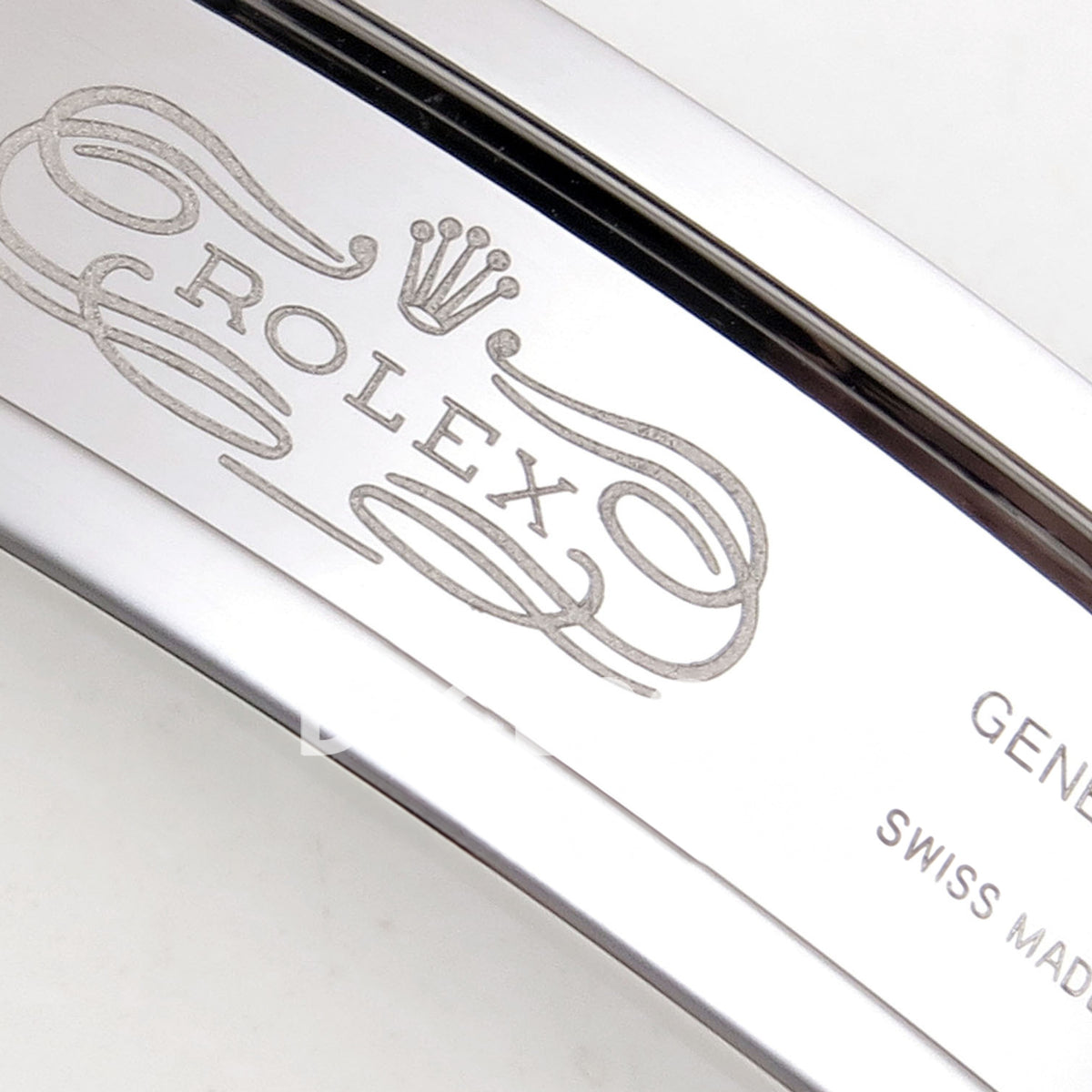 Rolex Daytona 126500 BTF replica, Rolex and Geneva clasp engraving detail