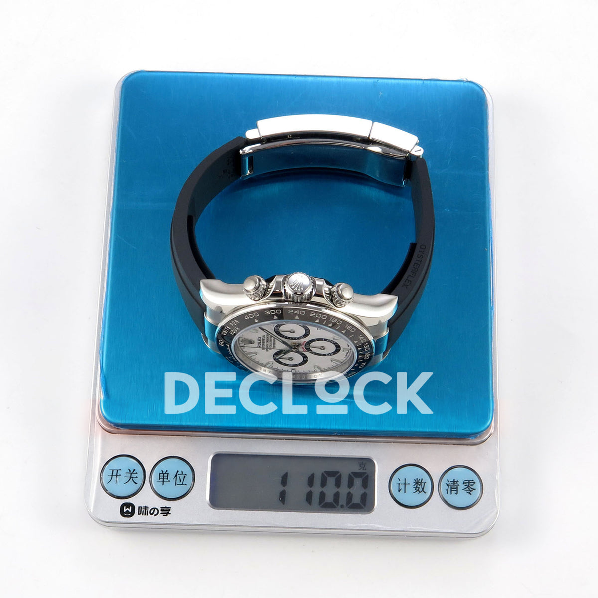 Rolex Daytona 126500 BTF replica, watch on digital scale showing 110 g