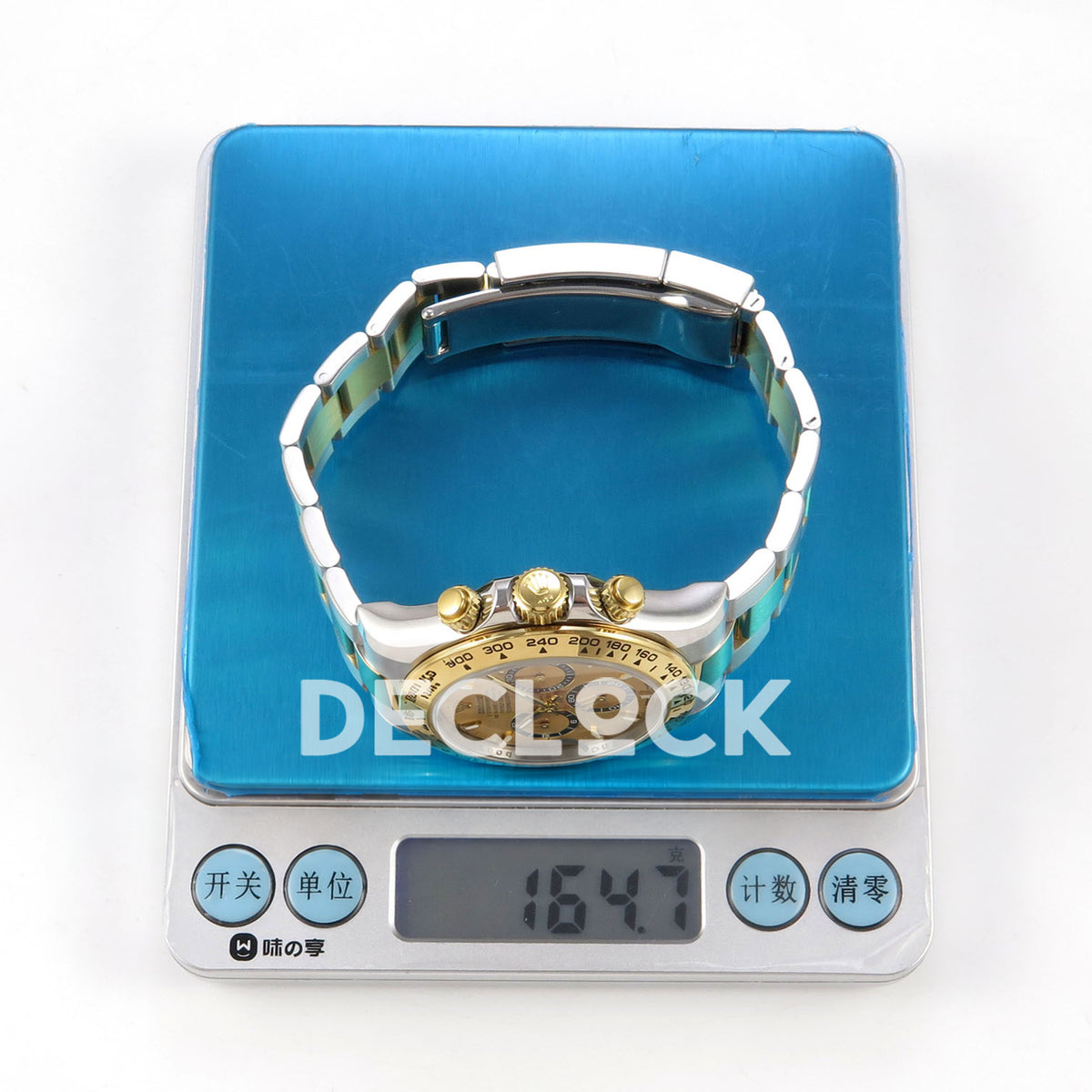 Rolex Daytona 126503 WF replica, watch on a digital scale showing 164.7 grams