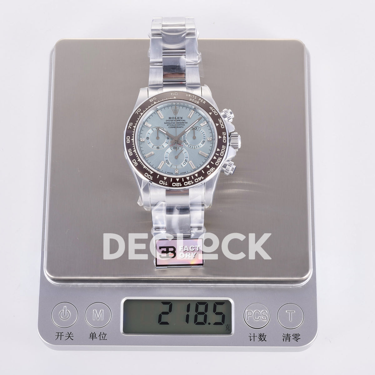 Rolex Daytona 126506 3BF replica - original watch and factory label on scale displaying 218.5 grams