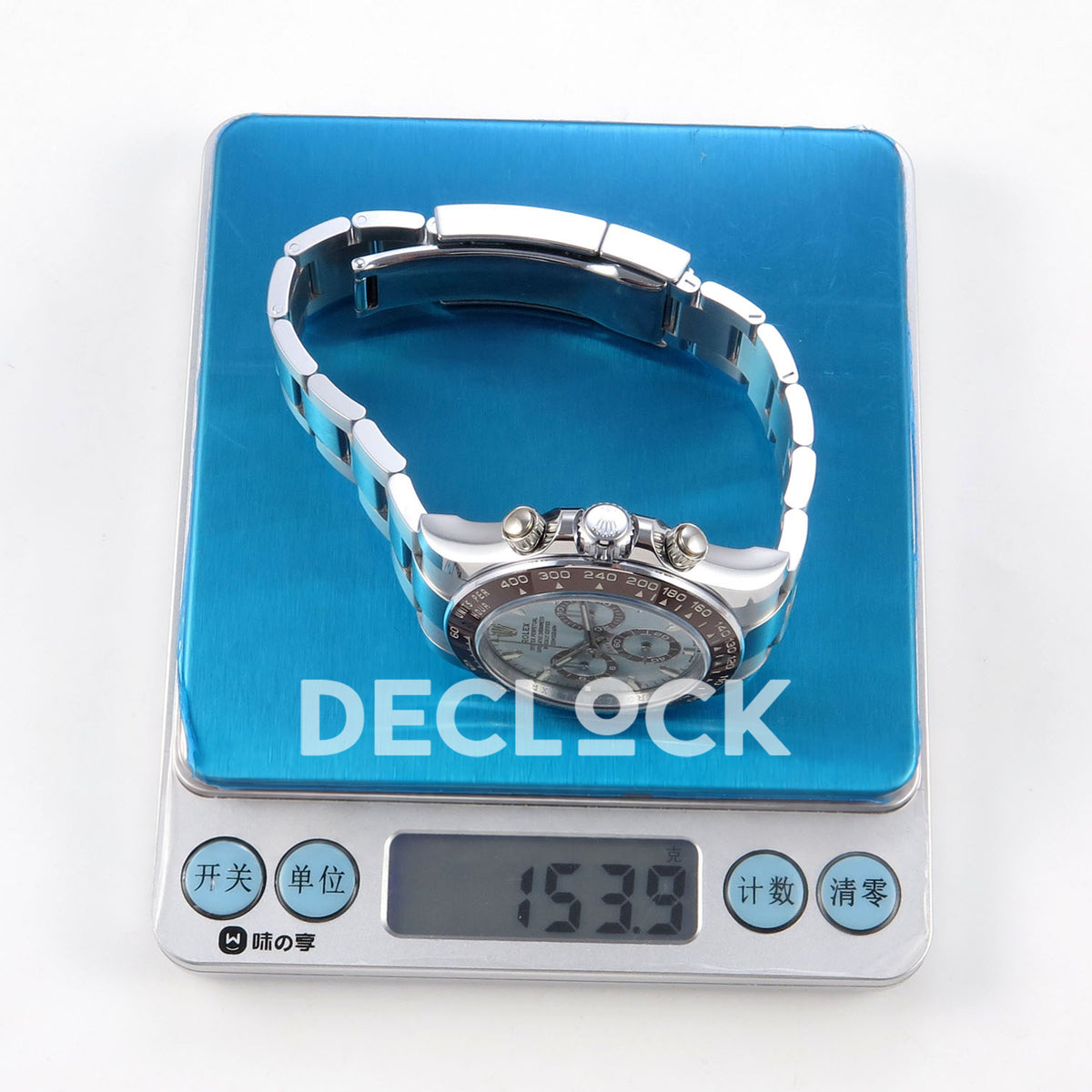 Rolex Daytona 126506 BTF replica, watch on a digital scale showing 153.9 grams