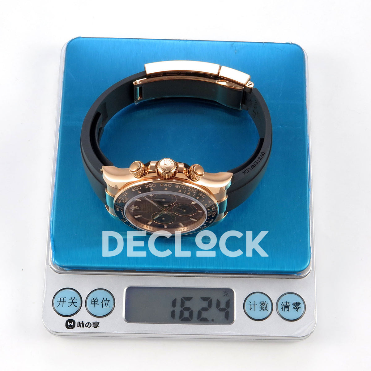 Rolex Daytona 126515 WF JH4131 brown dial rose-gold replica - watch photographed on a digital scale reading 162.4 g