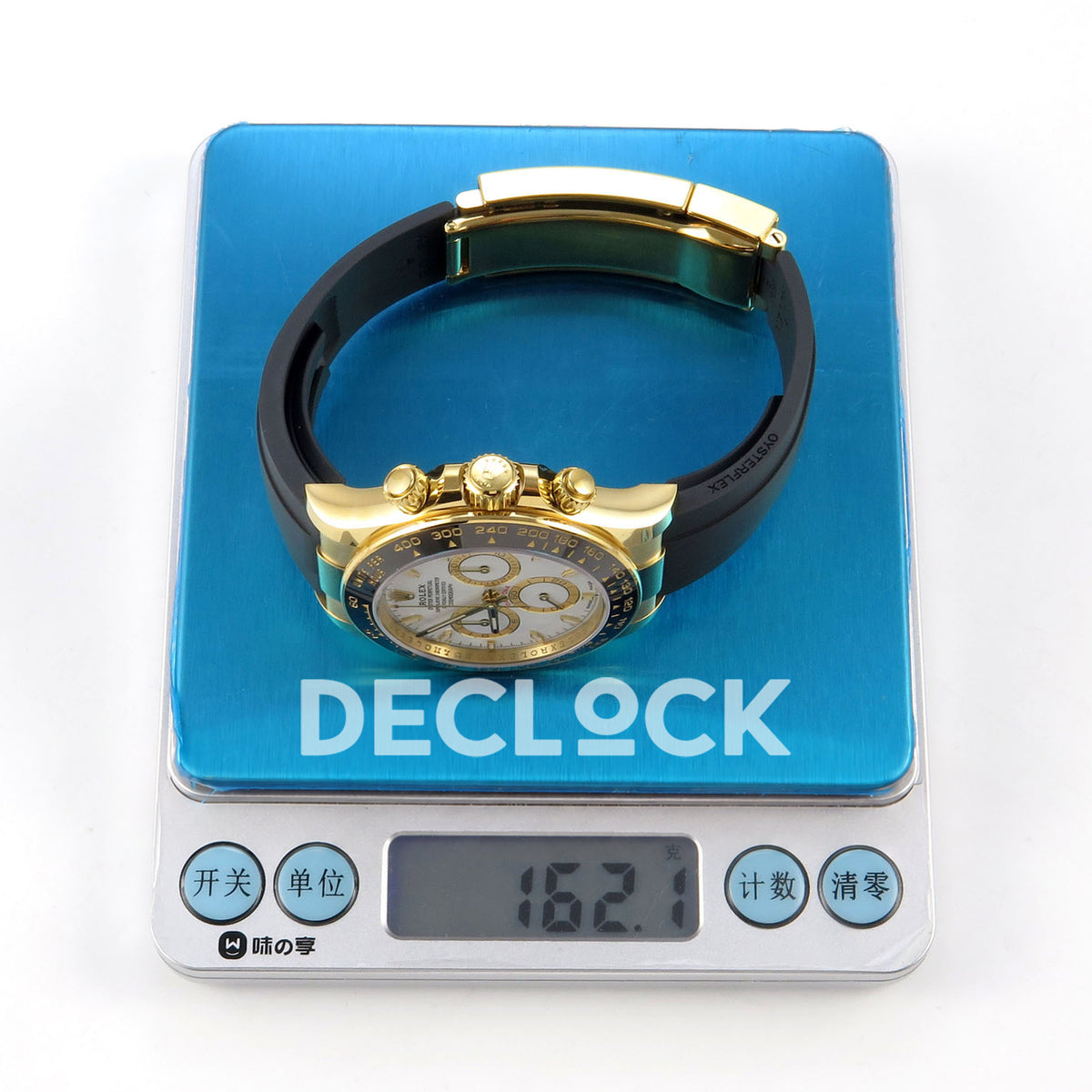 Rolex Daytona 126518 WF JH4131 white dial yellow-gold replica - watch and Oysterflex strap on a digital scale displaying 162.1 g