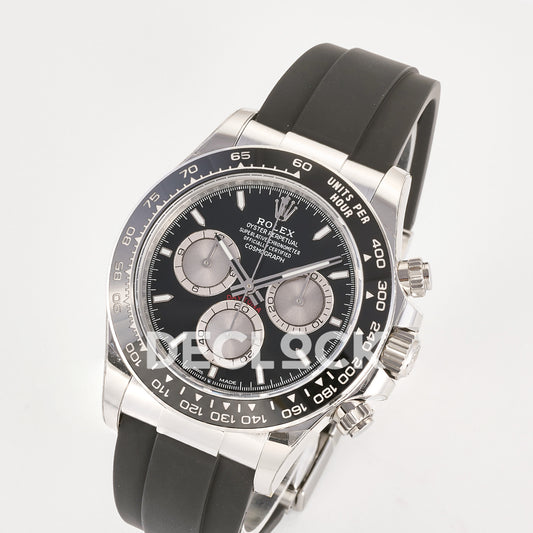 Rolex Daytona 126519 ARF replica - angled front view of black dial with silver chronograph counters and black ceramic tachymeter bezel