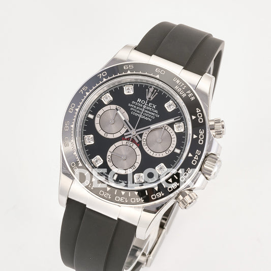 Rolex Daytona 126519 ARF replica - original black dial with silver chronograph faces, clear stone hour markers, silver hands, white Rolex printing and red Daytona text, black ceramic tachymeter bezel and black Oysterflex strap