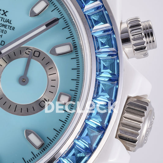 Rolex Daytona AET ADGF replica - dial luminous marker, blue faceted bezel stones, winding crown and pushers close-up