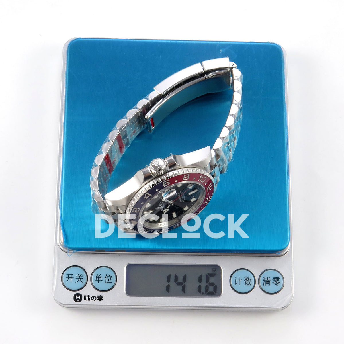 Rolex GMT-Master II 126710BLRO VSF V3s replica - watch on digital scale showing141.6g